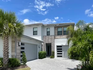 modern home with two garage doors with windows